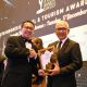 Penjabat Gubernur Gorontalo, Rudy Salahuddin, menerima penghargaan bergengsi dari ITTA Foundation dalam kategori Indonesia Top Hospitality Leader.(Foto : Diskominfotik)
